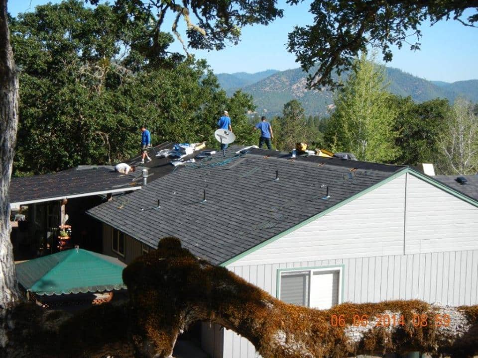 The Skye Roofing crew is apply the new shingles.