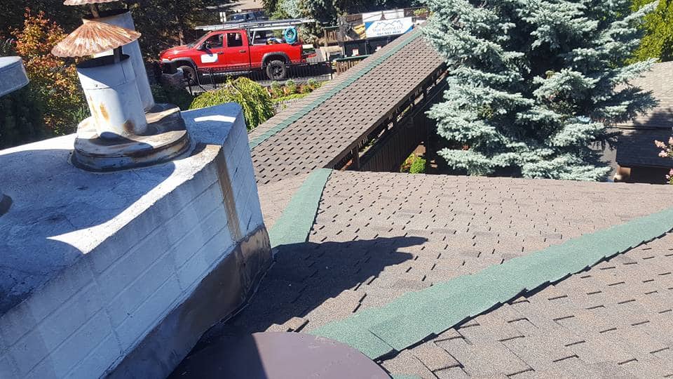 Looking down ocer the new rook covering part of the house and the covered deck.